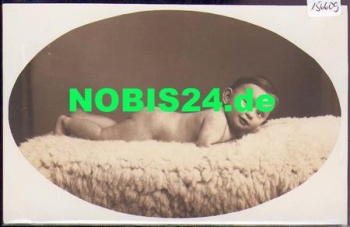 Naked child on sheepskin, real photo * approx. 1920