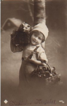 Child with pig in basket December 31, 1918