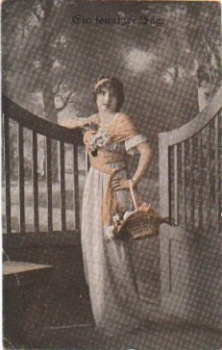 Lady with flower basket series card 8037/4 used. circa 1920