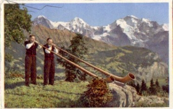 Alphorn players with Eiger, Mönch and Jungfrau, gebr. June 30, 1959