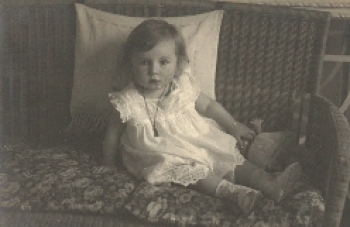 Girl with doll real photo card o February 13, 1914