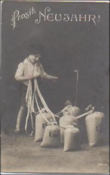 Child with sacks series card No. 223-4 used. December 31, 1914