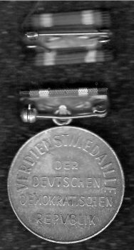 GDR Merit Medal on ribbon bar with interim clasp