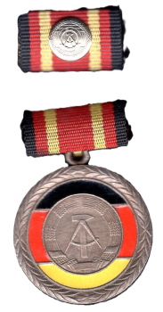 GDR Merit Medal on ribbon bar with interim clasp