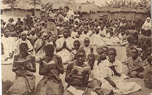 colored people praying catechism gebr. around 1920