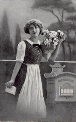 Mail, mailbox, woman with a basket of flowers o 11/27/1918