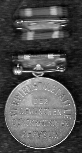 GDR Merit Medal on ribbon bar with interim clasp
