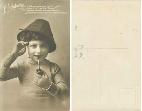 Boy smoking a pipe * around 1910