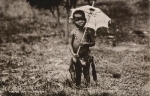 colored child with parasol * approx. 1920