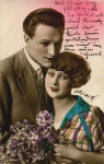 Kiss, couple in arms with flowers, No. 2355/3 gebr. 12/28/1924