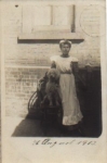 Poodle on chair with mistress real photo card o 28.8.1913
