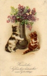 Cat in front of a flower vase with a butterfly and lilacs o 1.2.1927