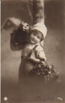 Child with pig in basket December 31, 1918