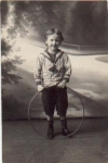 Boy with hula hoop real photo card used. circa 1920