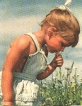 Girl in a flower meadow o July 23, 1963