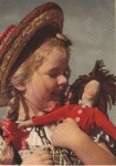 Girl with doll o 26.11.1943