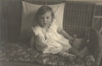 Girl with doll real photo card o February 13, 1914